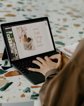 Designer creating designs on a laptop using Fotor's web app